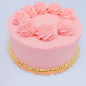 cake; strawberry filling; chocolate ganache frosting; golden pearls